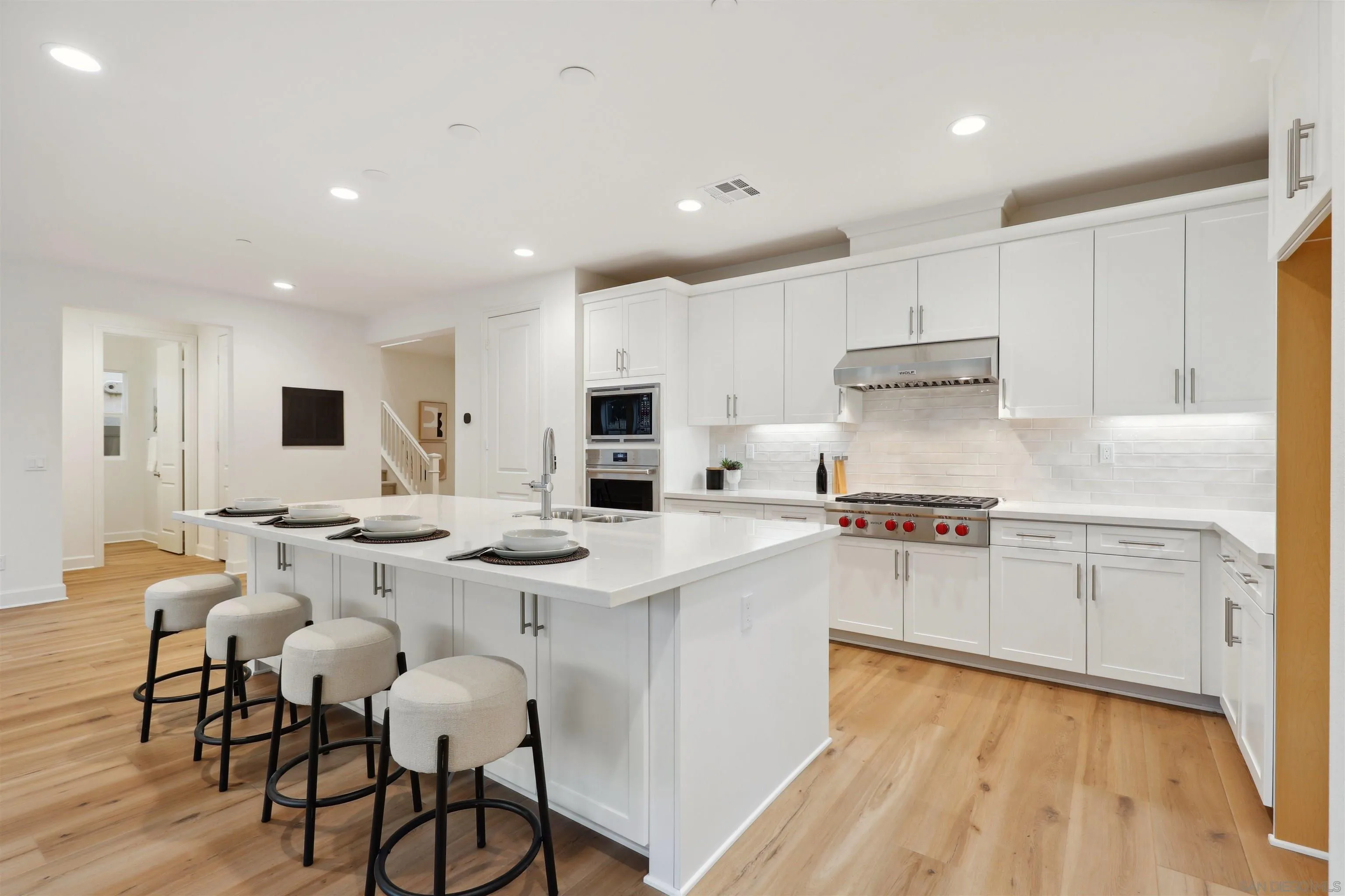 929 Woodhaven Road San Marcos, CA 92069 - Photo 9 of 36 a kitchen with stainless steel appliances kitchen island granite countertop a sink and cabinets