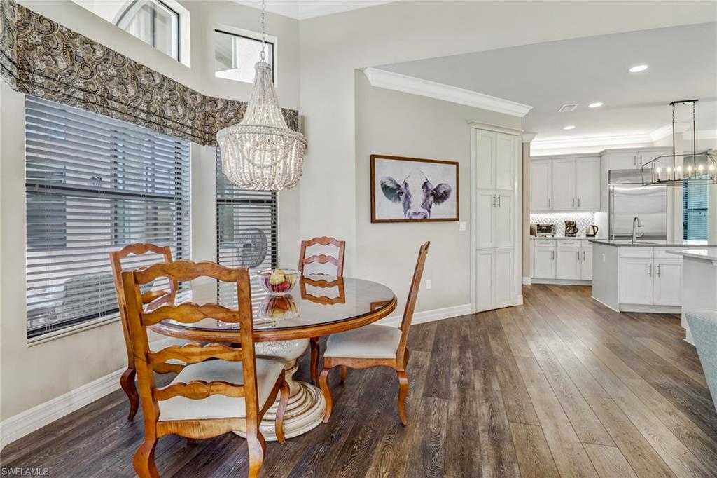 4663 Azalea Drive Naples, FL 34119 - Photo 13 of 34 a view of a dining room with furniture and wooden floor