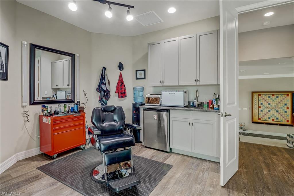 4663 Azalea Drive Naples, FL 34119 - Photo 29 of 34 a living room with furniture and a wooden floor