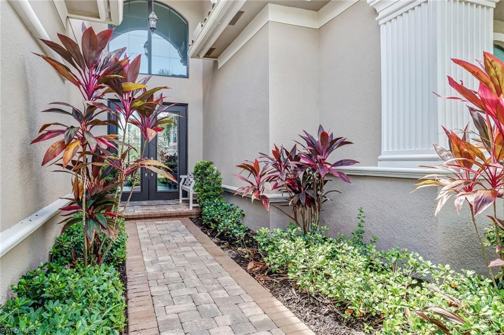4663 Azalea Drive Naples, FL 34119 - Photo 30 of 34 a vase with flowers sitting on a floor