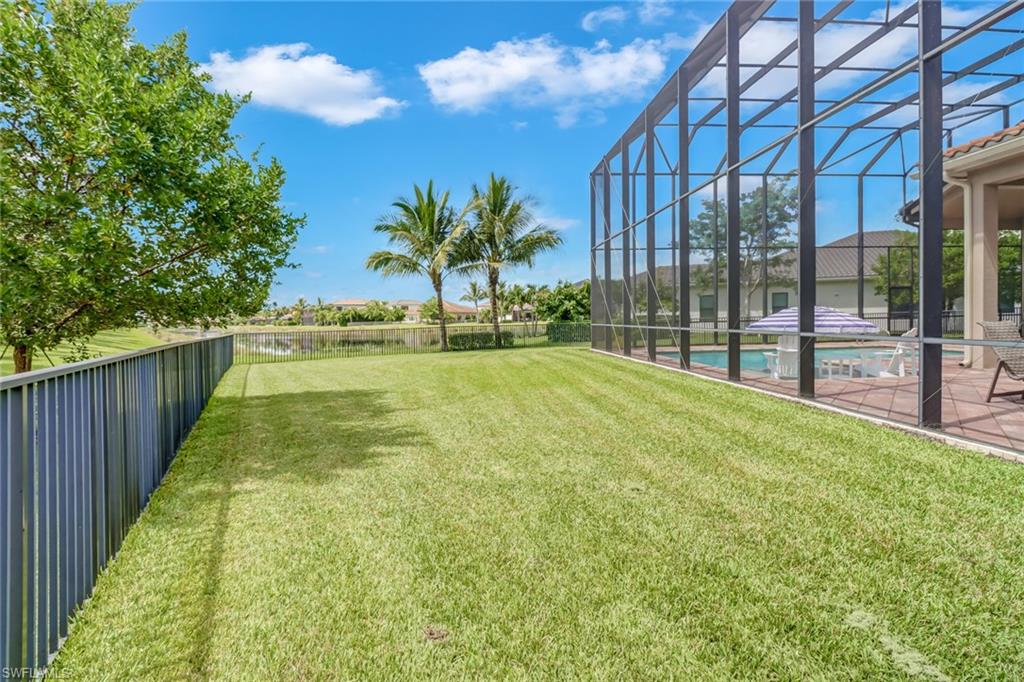 4663 Azalea Drive Naples, FL 34119 - Photo 32 of 34 a view of backyard with swimming pool and outdoor seating