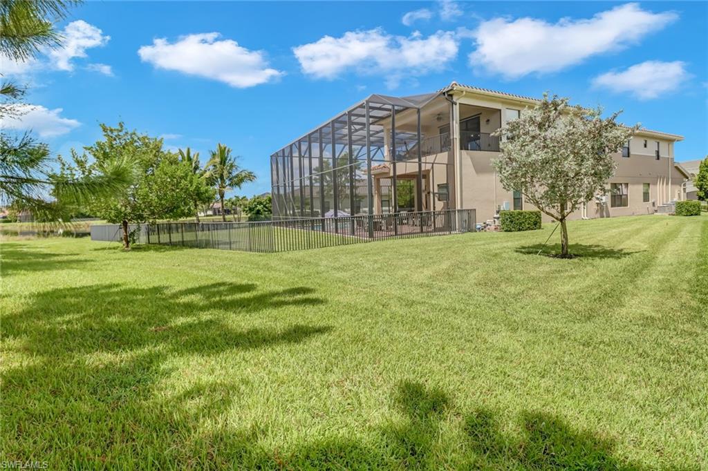 4663 Azalea Drive Naples, FL 34119 - Photo 34 of 34 a view of a big room with a big yard and plants