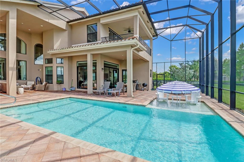 4663 Azalea Drive Naples, FL 34119 - Photo 4 of 34 a view of a building with a yard