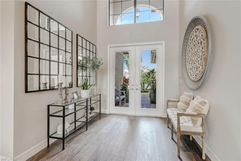 4663 Azalea Drive Naples, FL 34119 - Photo 5 of 34 a view of a livingroom with furniture and entryway
