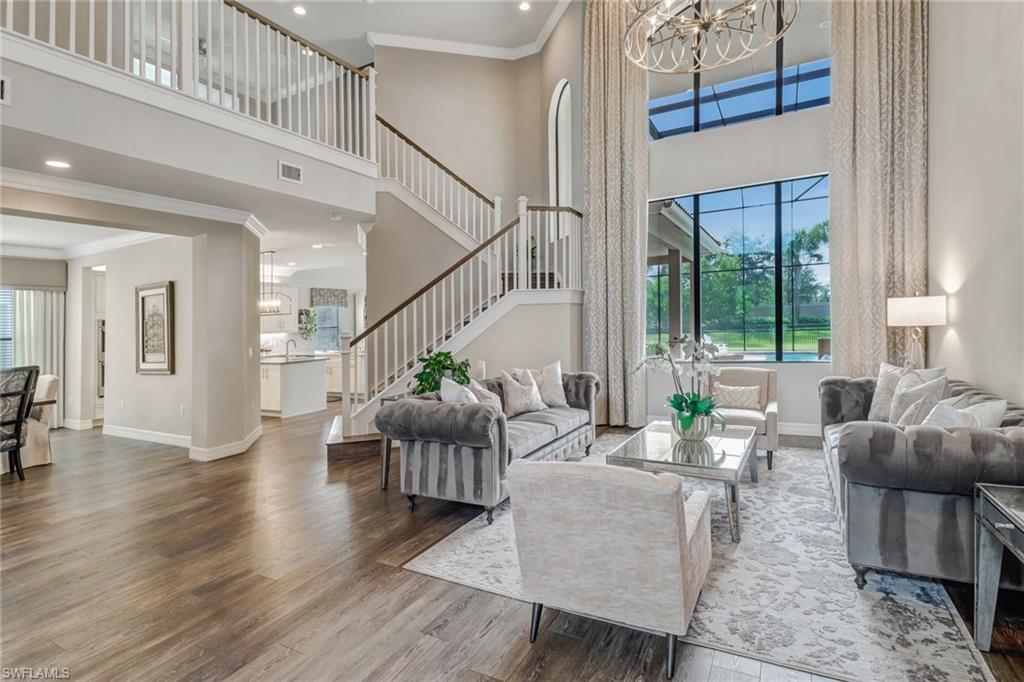 4663 Azalea Drive Naples, FL 34119 - Photo 6 of 34 a living room with furniture and a large window
