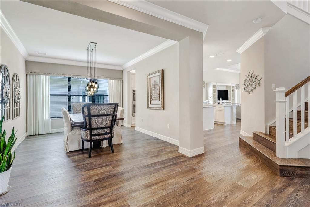 4663 Azalea Drive Naples, FL 34119 - Photo 7 of 34 a dining room with furniture and wooden floor