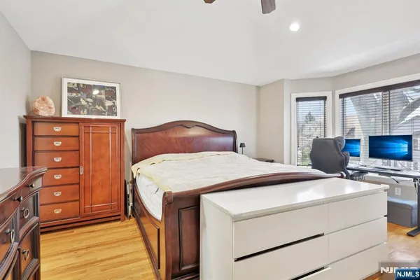 a bedroom with a bed and a dresser