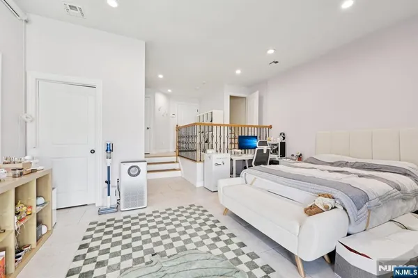 a bed room with a bed and a couch