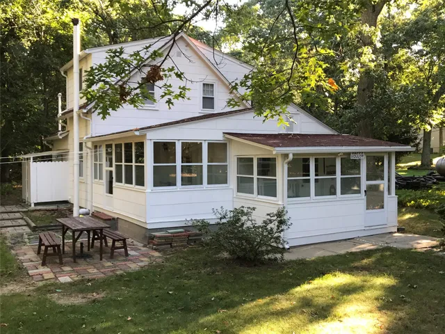 a house with swimming pool in front of it