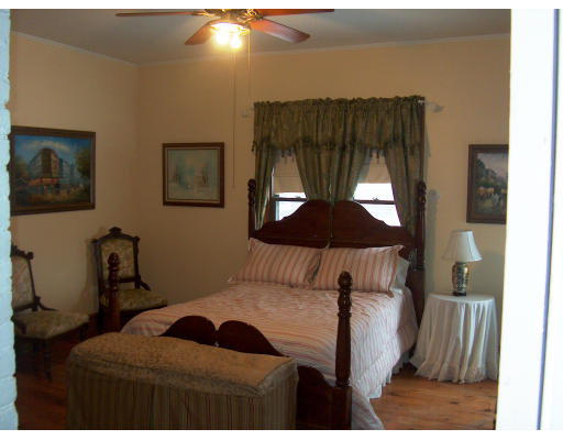 95 Buckingham Street Springfield, MA 01109 - Photo 17 of 24 a bedroom with a bed and a painting on the wall