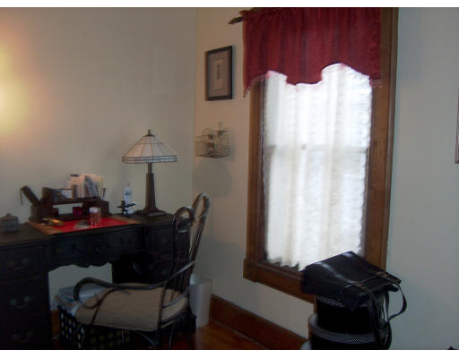 95 Buckingham Street Springfield, MA 01109 - Photo 19 of 24 a dining room with furniture and a window