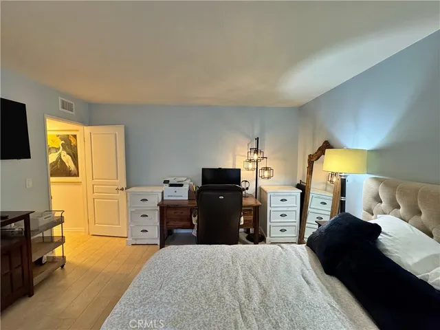 a bedroom with a bed and furniture