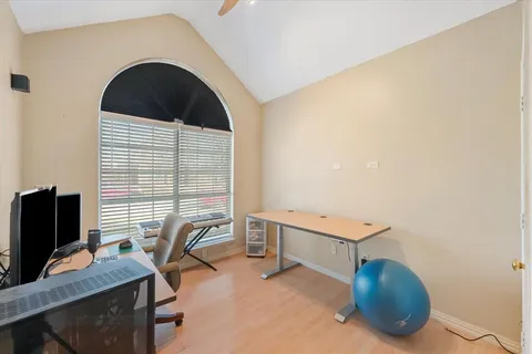 a bathroom with a toilet a sink a mirror and shower