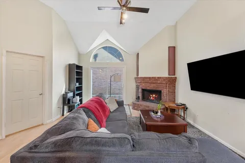 a living room with furniture fireplace and a flat screen tv