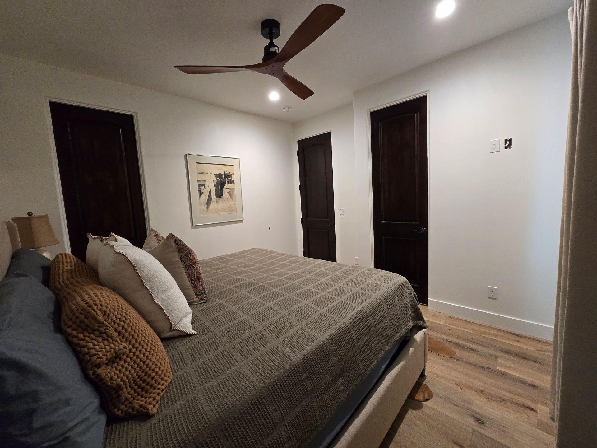 240 Rockinghorse Bend Road Payson, AZ 85541 - Photo 18 of 53 a bedroom with a bed and a walk in closet