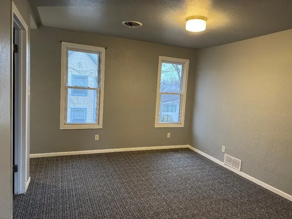 an empty room with windows