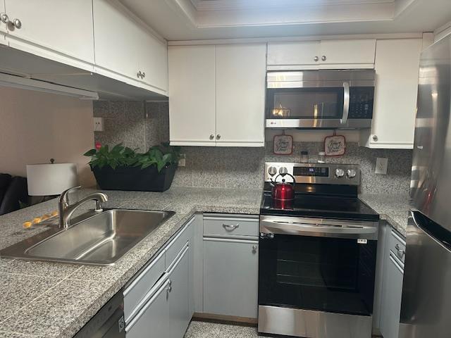 2511 Fulton Square Lane, Unit 9 Sacramento, CA 95821 - Photo 3 of 19 a kitchen with stainless steel appliances granite countertop a sink stove and microwave