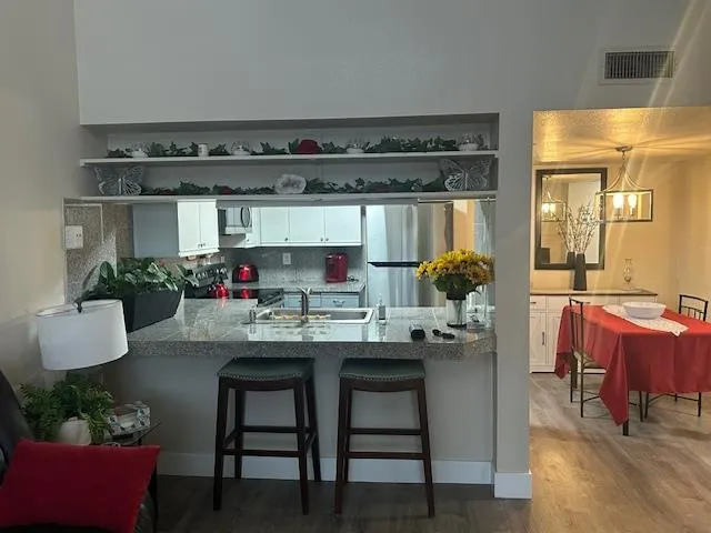 a kitchen with a table and chairs in it