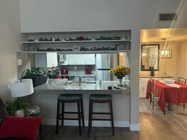 2511 Fulton Square Lane, Unit 9 Sacramento, CA 95821 - Photo 7 of 19 a kitchen with a table and chairs in it