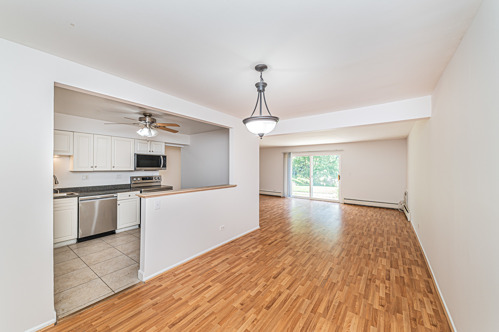 714 East Algonquin Road, Unit J101 Arlington Heights, IL 60005 - Photo 11 of 28 a view of kitchen with sink a microwave and stove