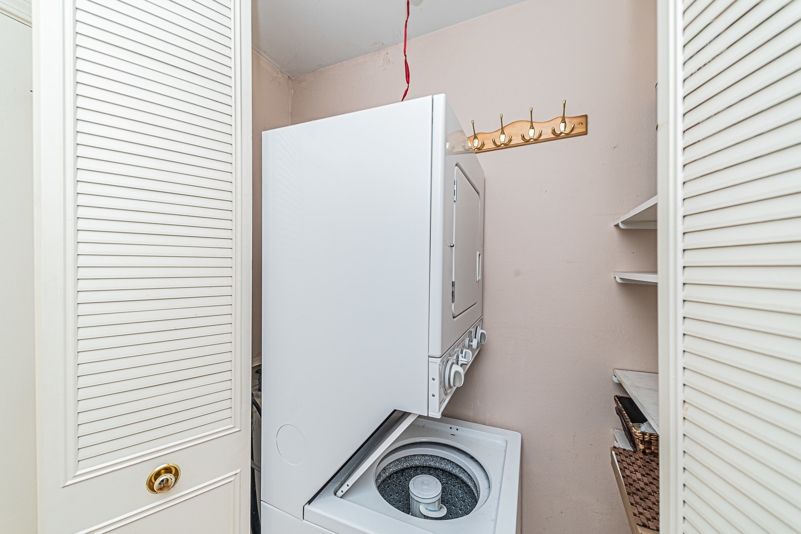 714 East Algonquin Road, Unit J101 Arlington Heights, IL 60005 - Photo 24 of 28 a utility room with dryer and washer