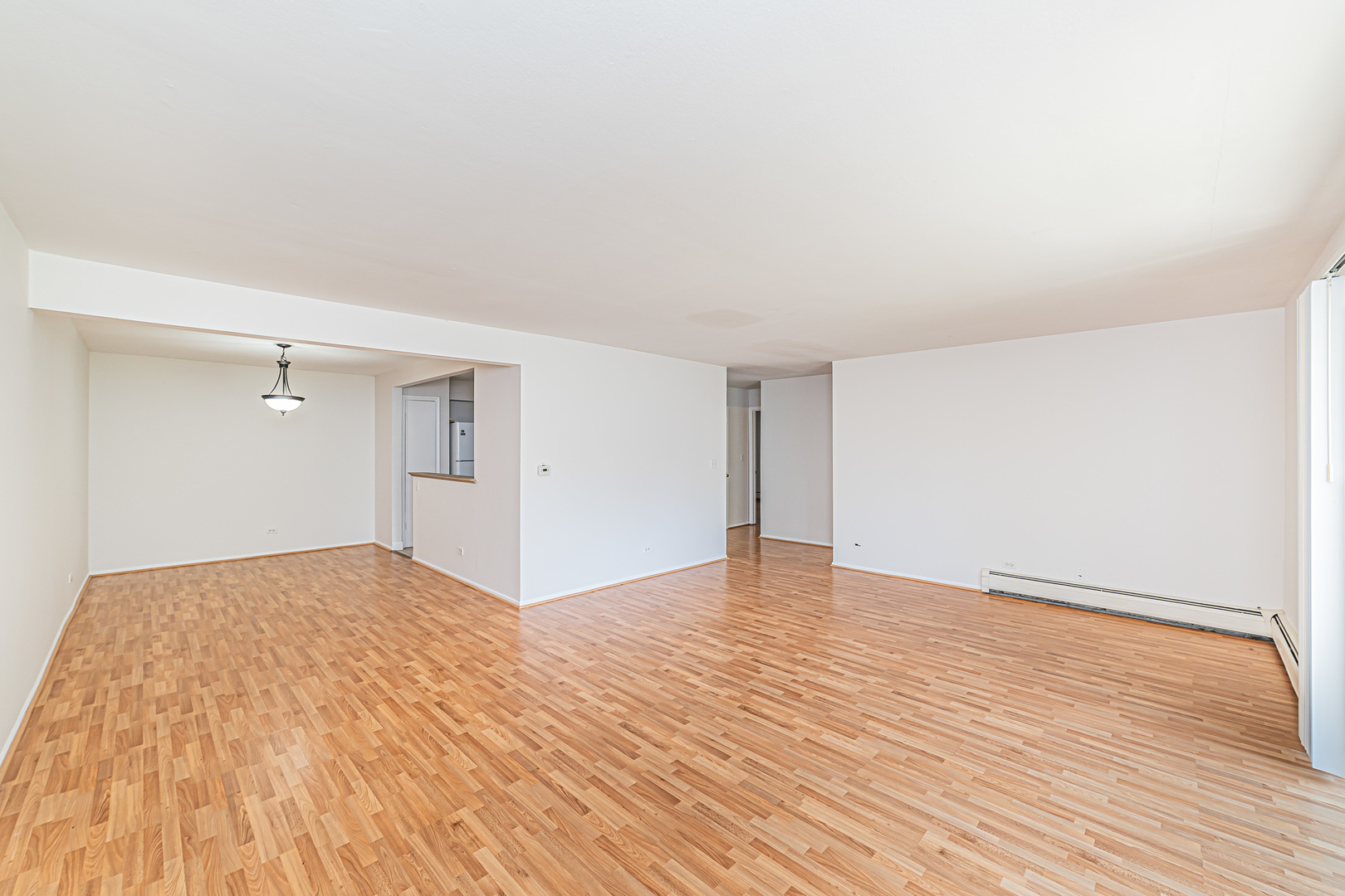 714 East Algonquin Road, Unit J101 Arlington Heights, IL 60005 - Photo 7 of 28 a view of empty room with wooden floor