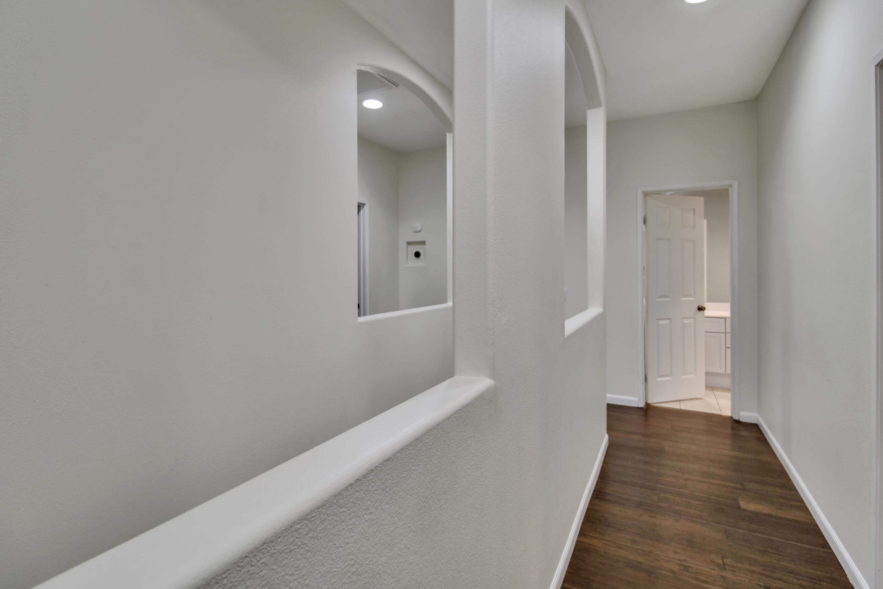 82949 Corte Lucia Indio, CA 92201 - Photo 10 of 36 a view of a hallway with wooden floor