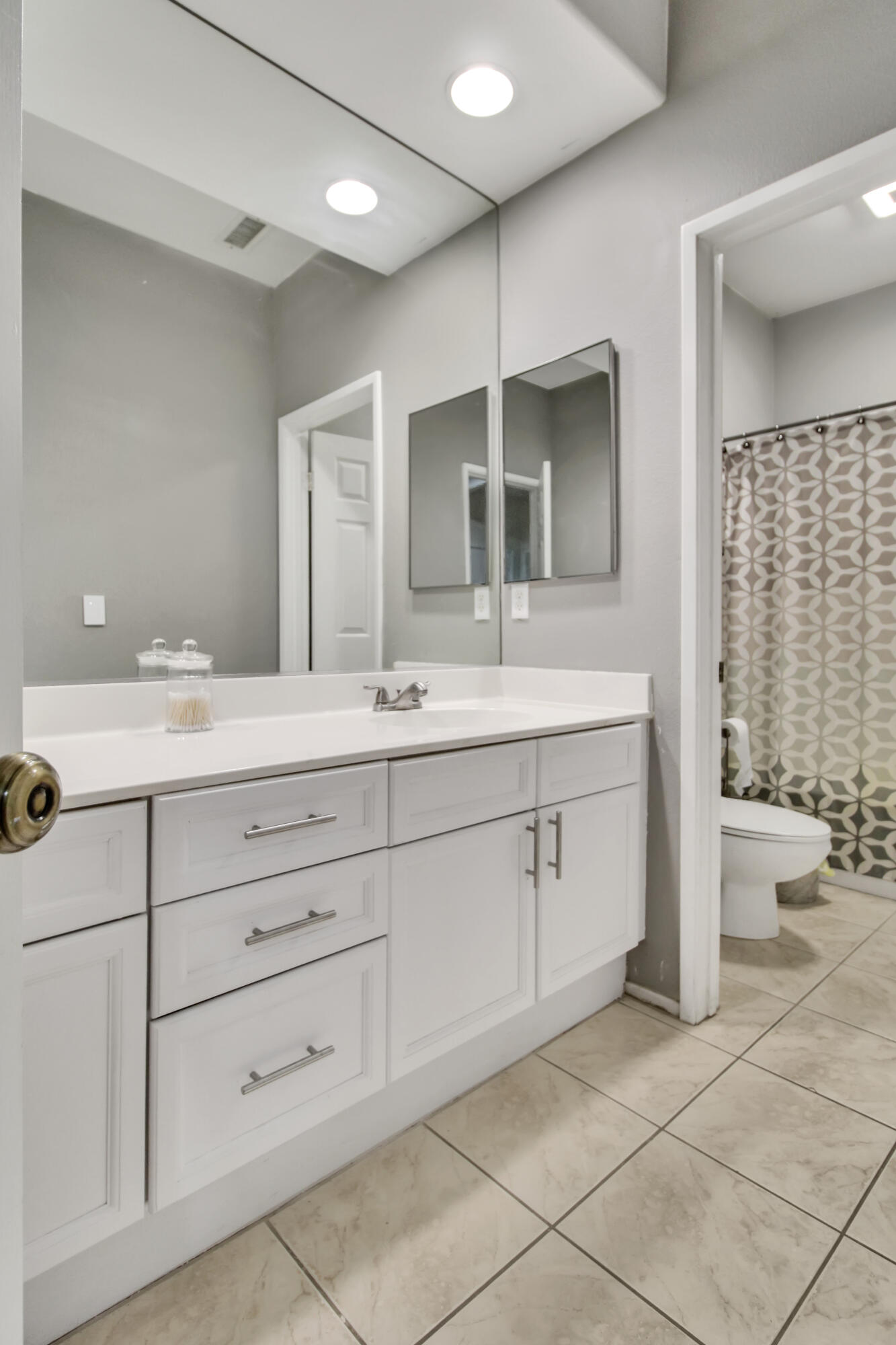 82949 Corte Lucia Indio, CA 92201 - Photo 11 of 36 a bathroom with a double vanity sink a toilet and a mirror