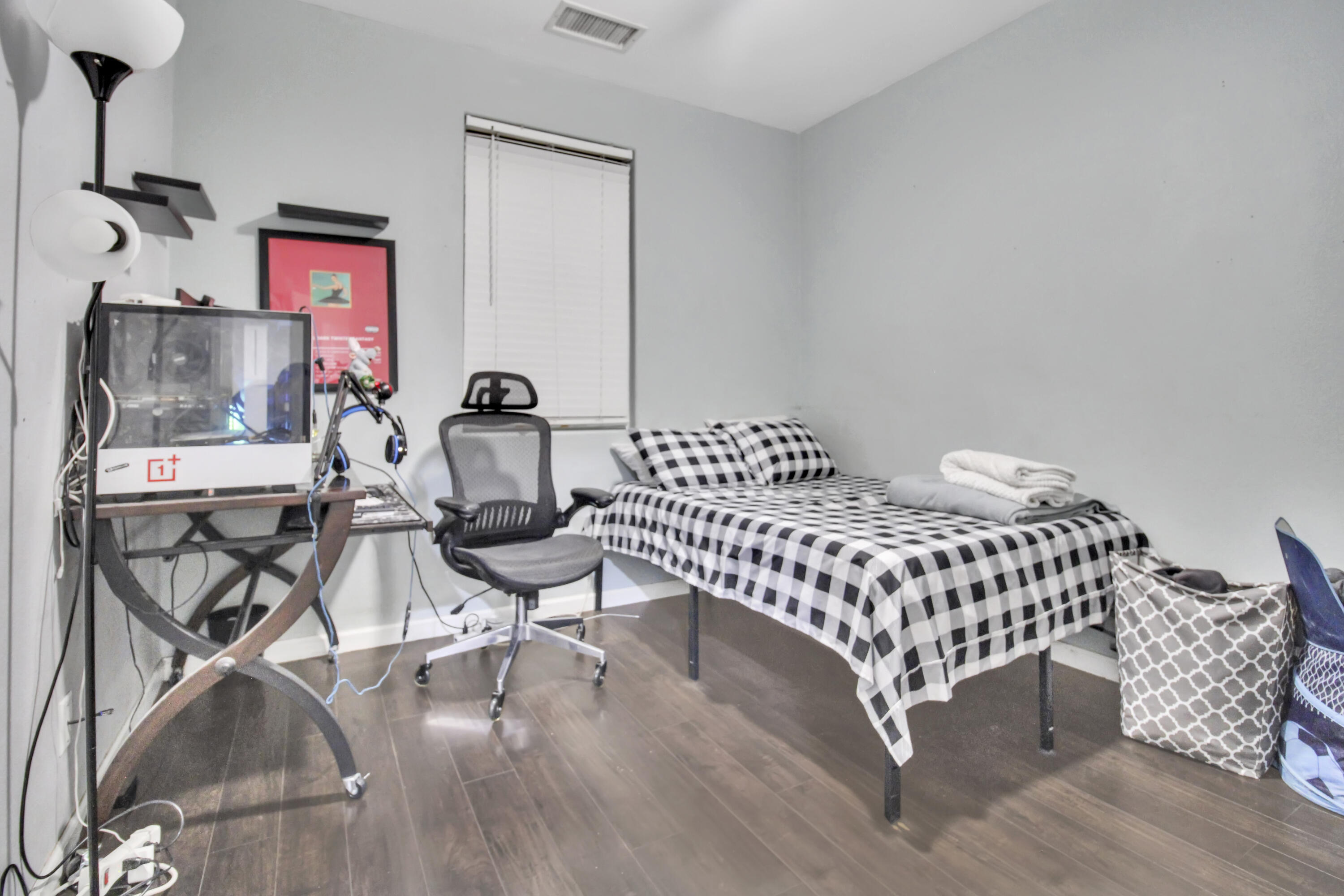 82949 Corte Lucia Indio, CA 92201 - Photo 13 of 36 a bedroom with a bed and chair