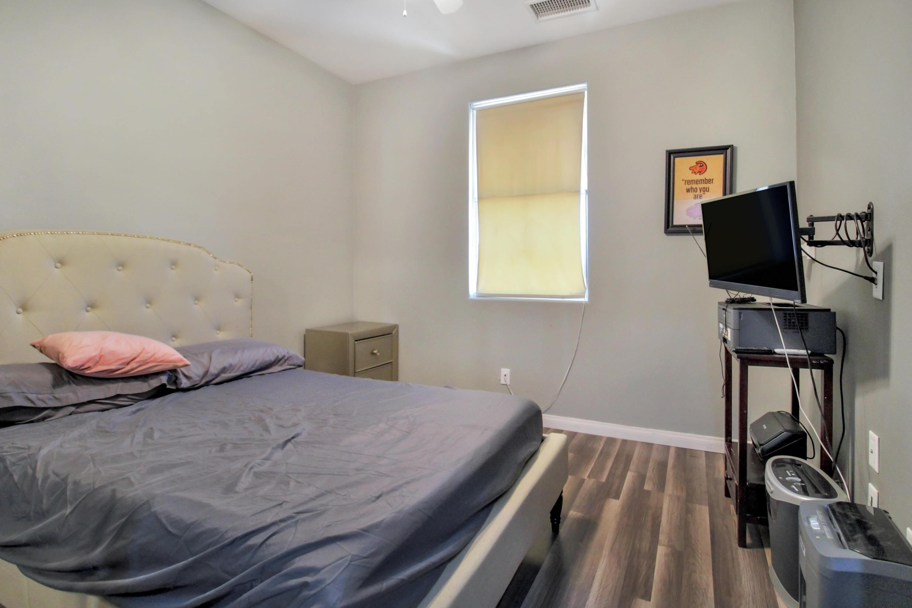 82949 Corte Lucia Indio, CA 92201 - Photo 14 of 36 a bedroom with a bed and a flat tv screen on a dresser
