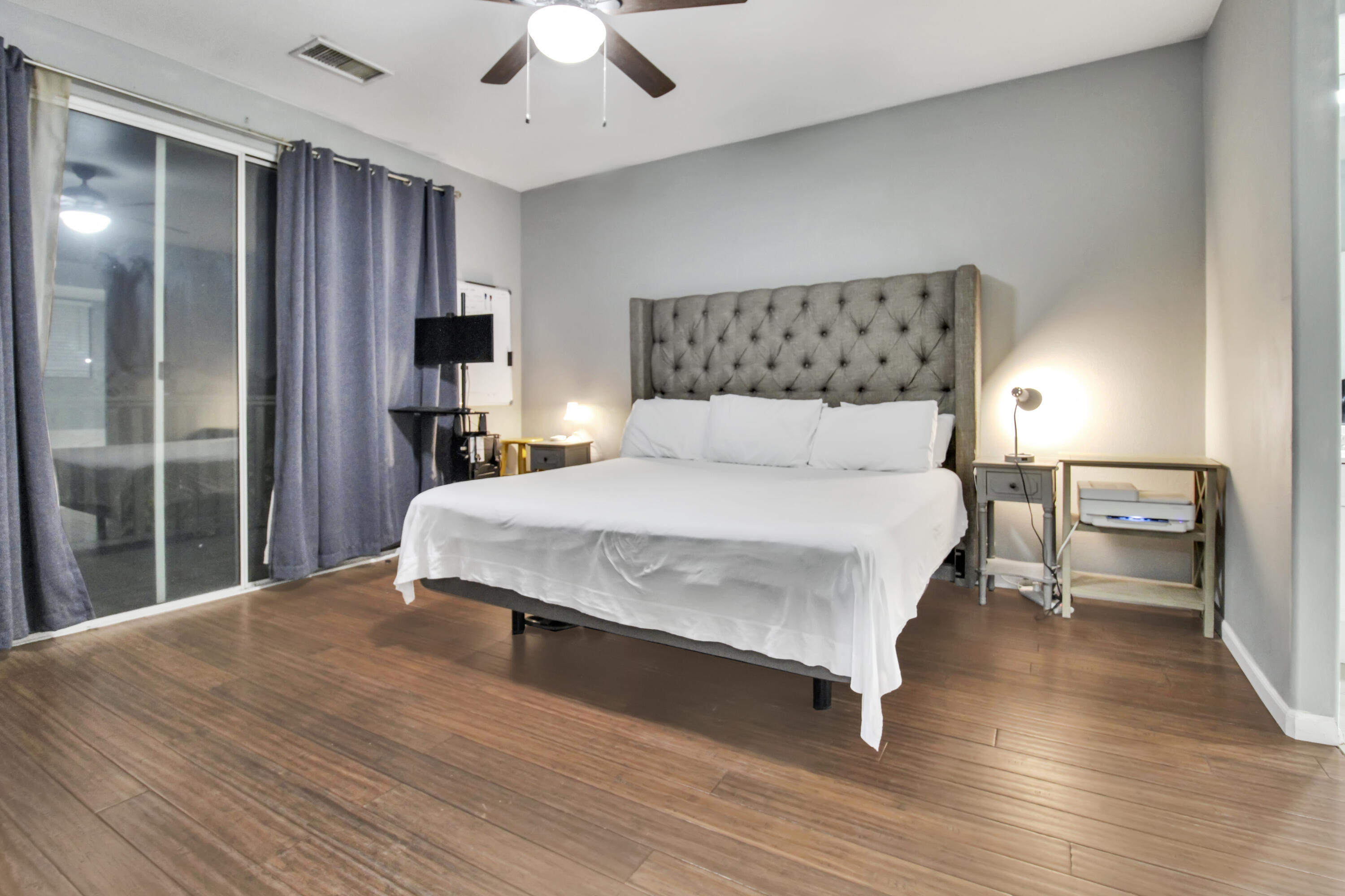 82949 Corte Lucia Indio, CA 92201 - Photo 18 of 36 a bedroom with a bed mirror and a window