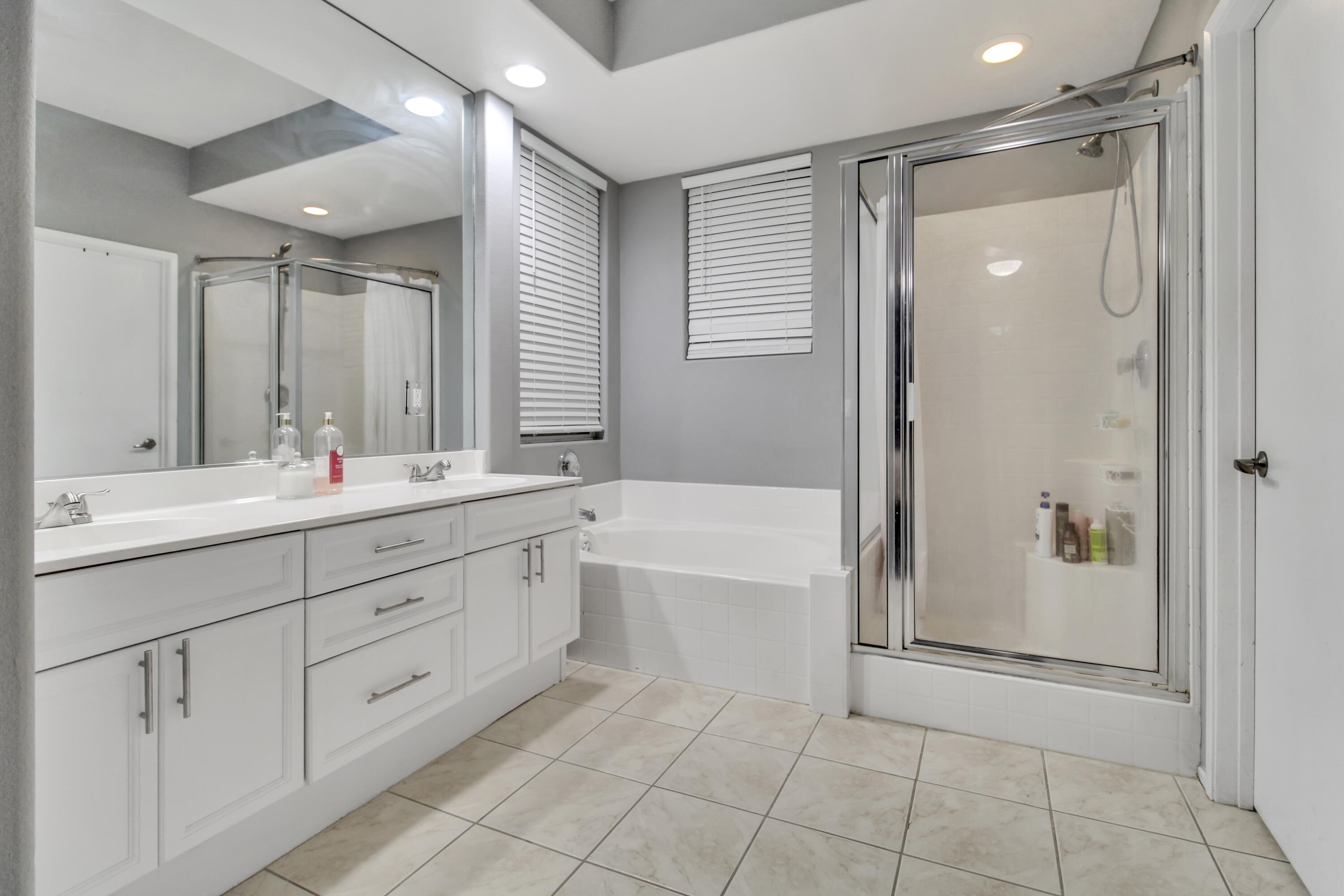 82949 Corte Lucia Indio, CA 92201 - Photo 19 of 36 a bathroom with a tub sink shower and mirror