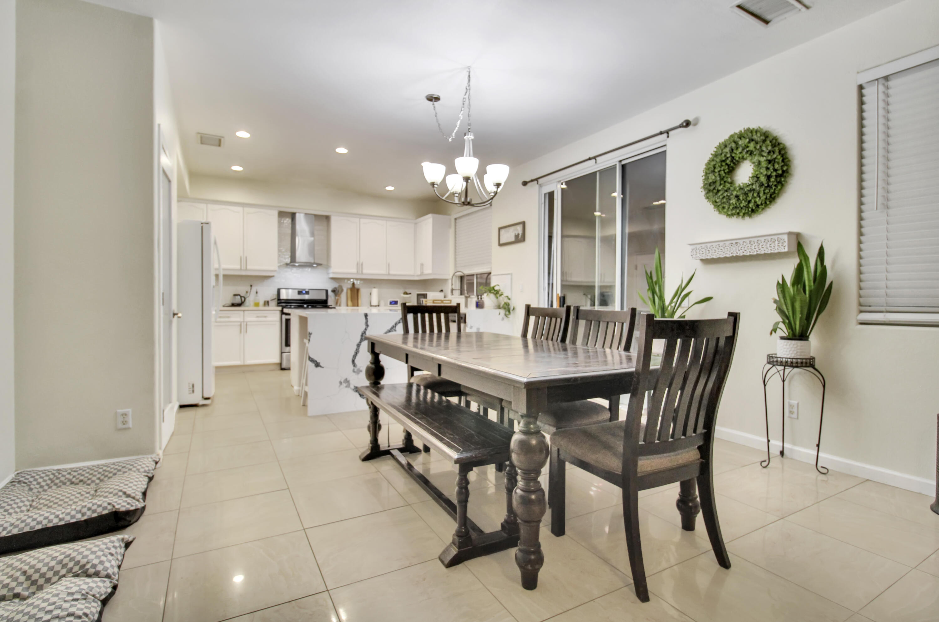 82949 Corte Lucia Indio, CA 92201 - Photo 3 of 36 a view of a dining room with furniture and chandelier