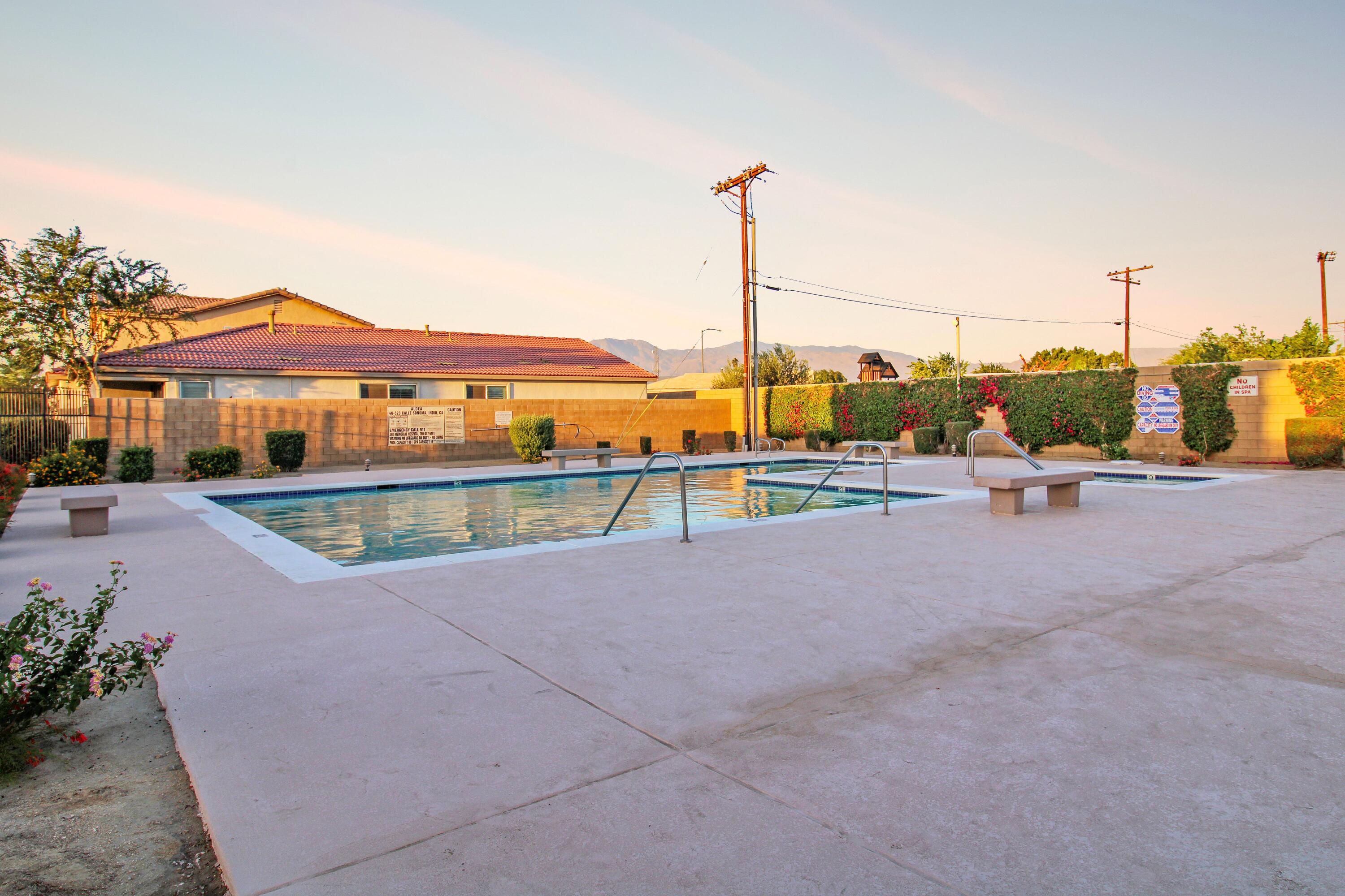 82949 Corte Lucia Indio, CA 92201 - Photo 31 of 36 a view of a swimming pool with a patio