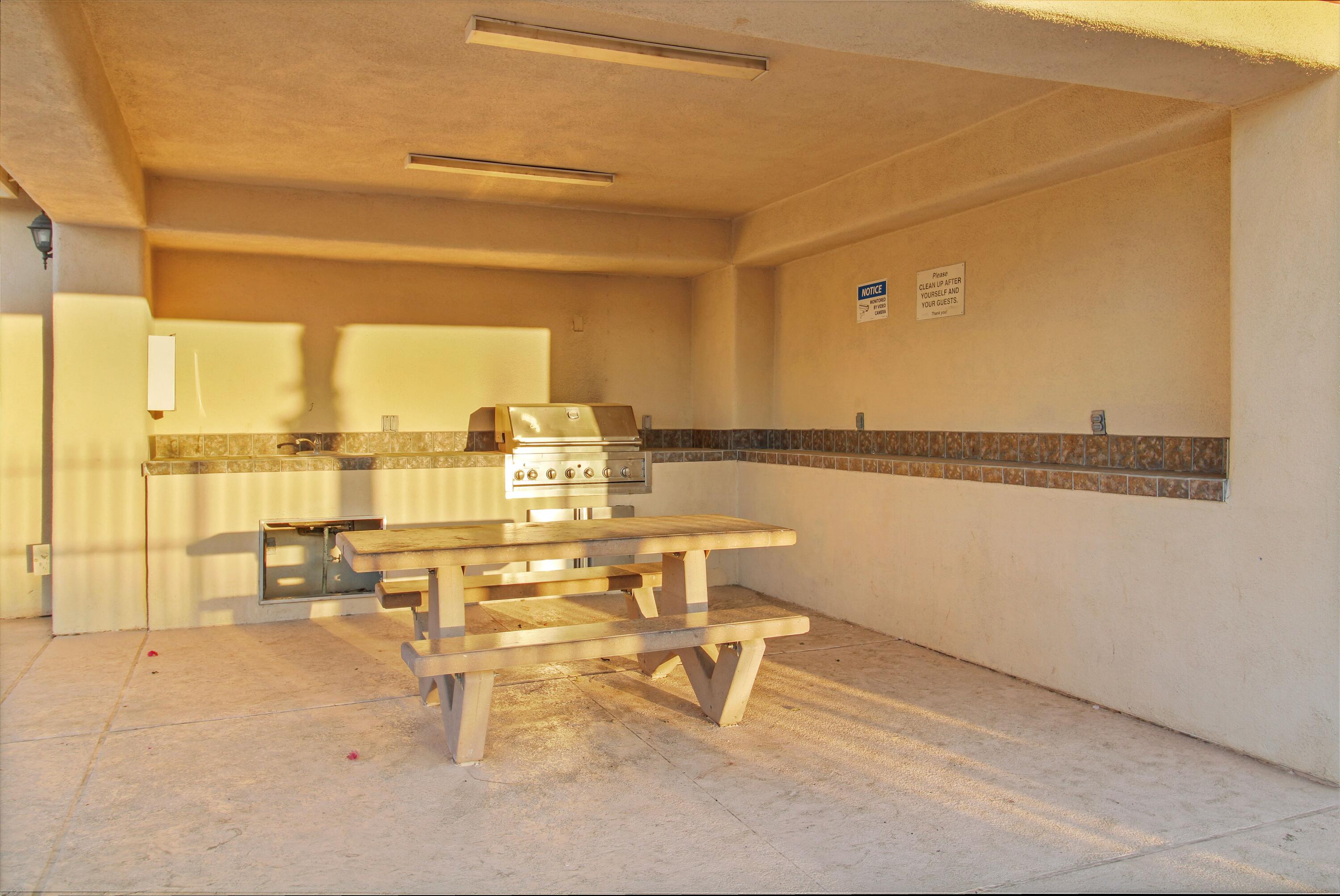 82949 Corte Lucia Indio, CA 92201 - Photo 33 of 36 a room with a table and chairs