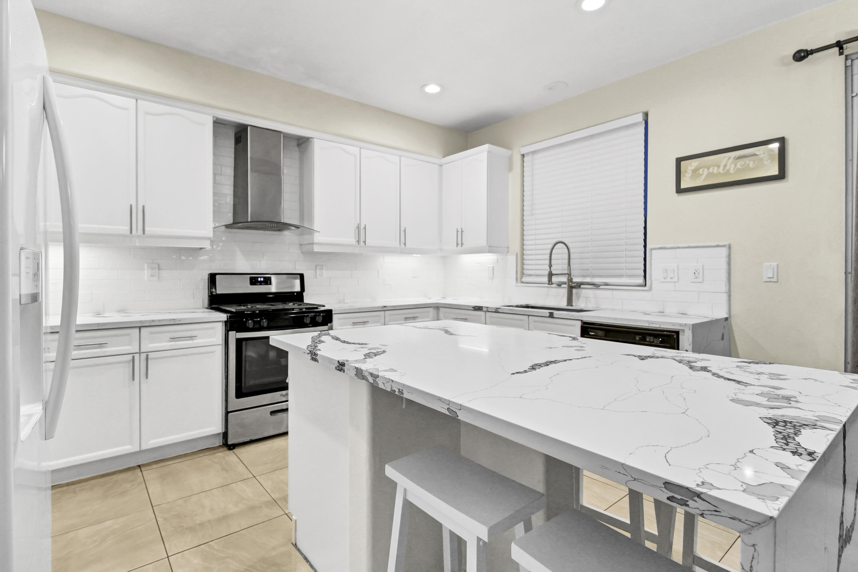 82949 Corte Lucia Indio, CA 92201 - Photo 5 of 36 a kitchen with a sink stove and white cabinets