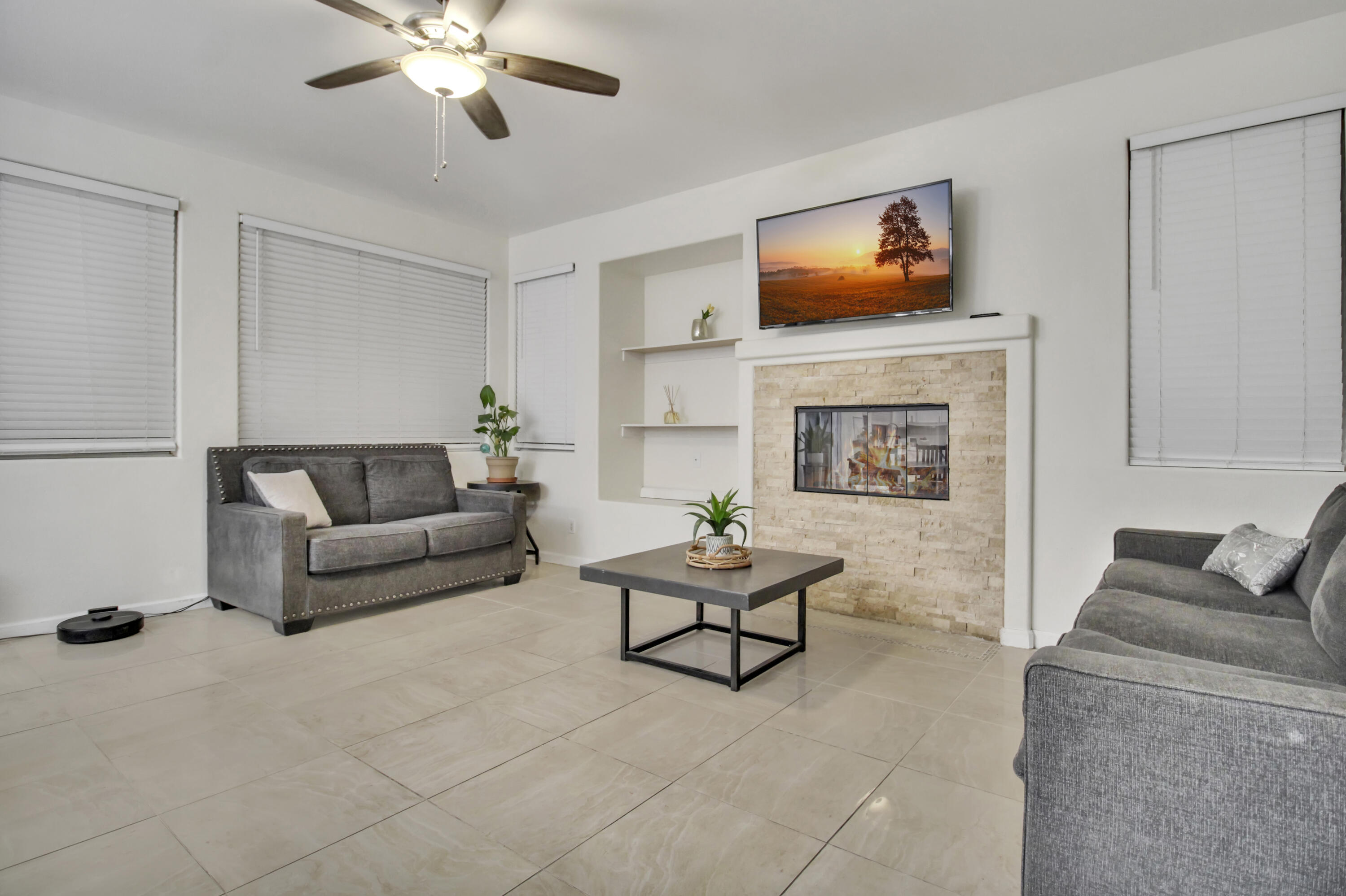 82949 Corte Lucia Indio, CA 92201 - Photo 6 of 36 a living room with furniture and a fireplace
