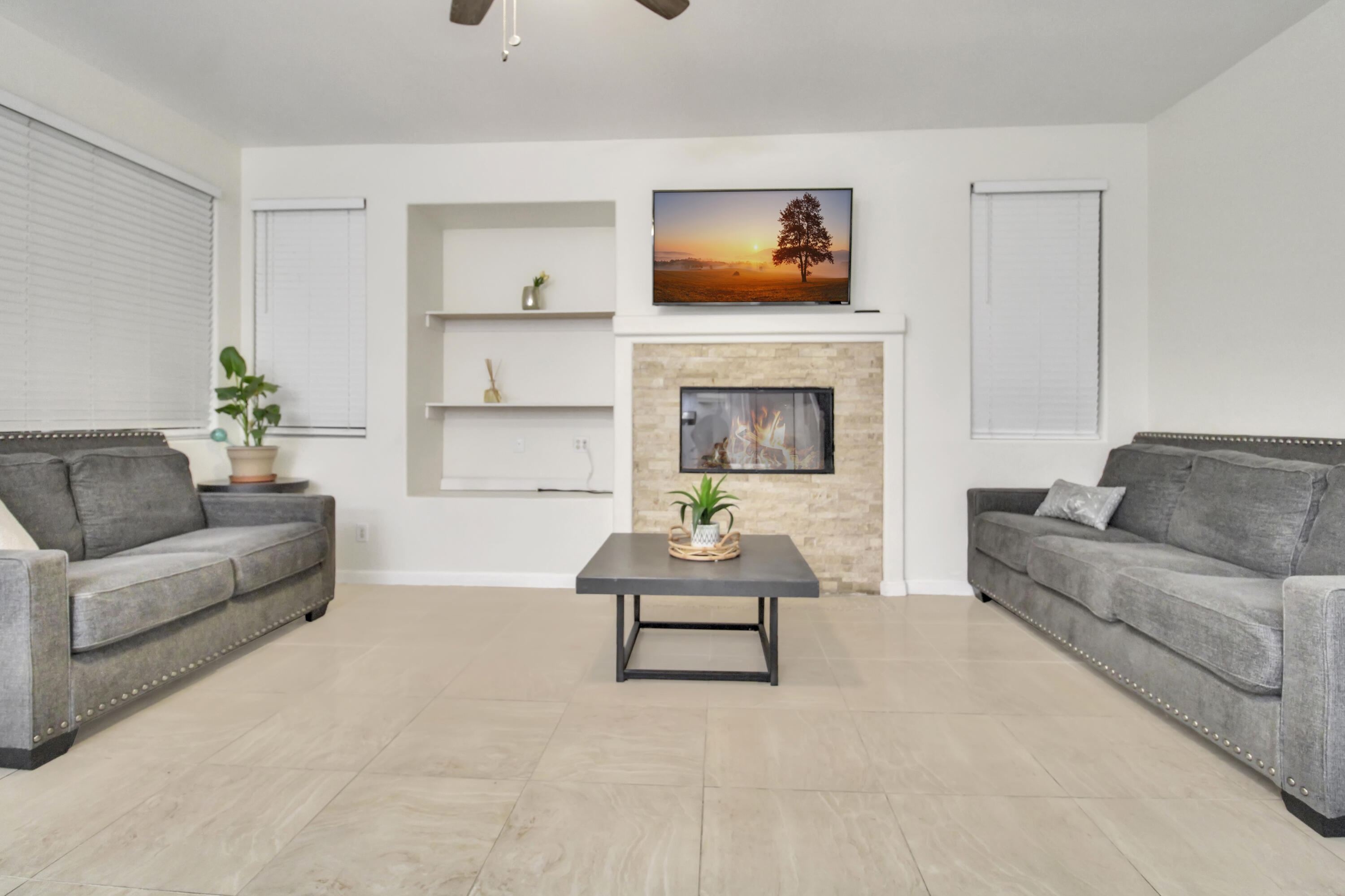 82949 Corte Lucia Indio, CA 92201 - Photo 7 of 36 a living room with furniture and a fireplace