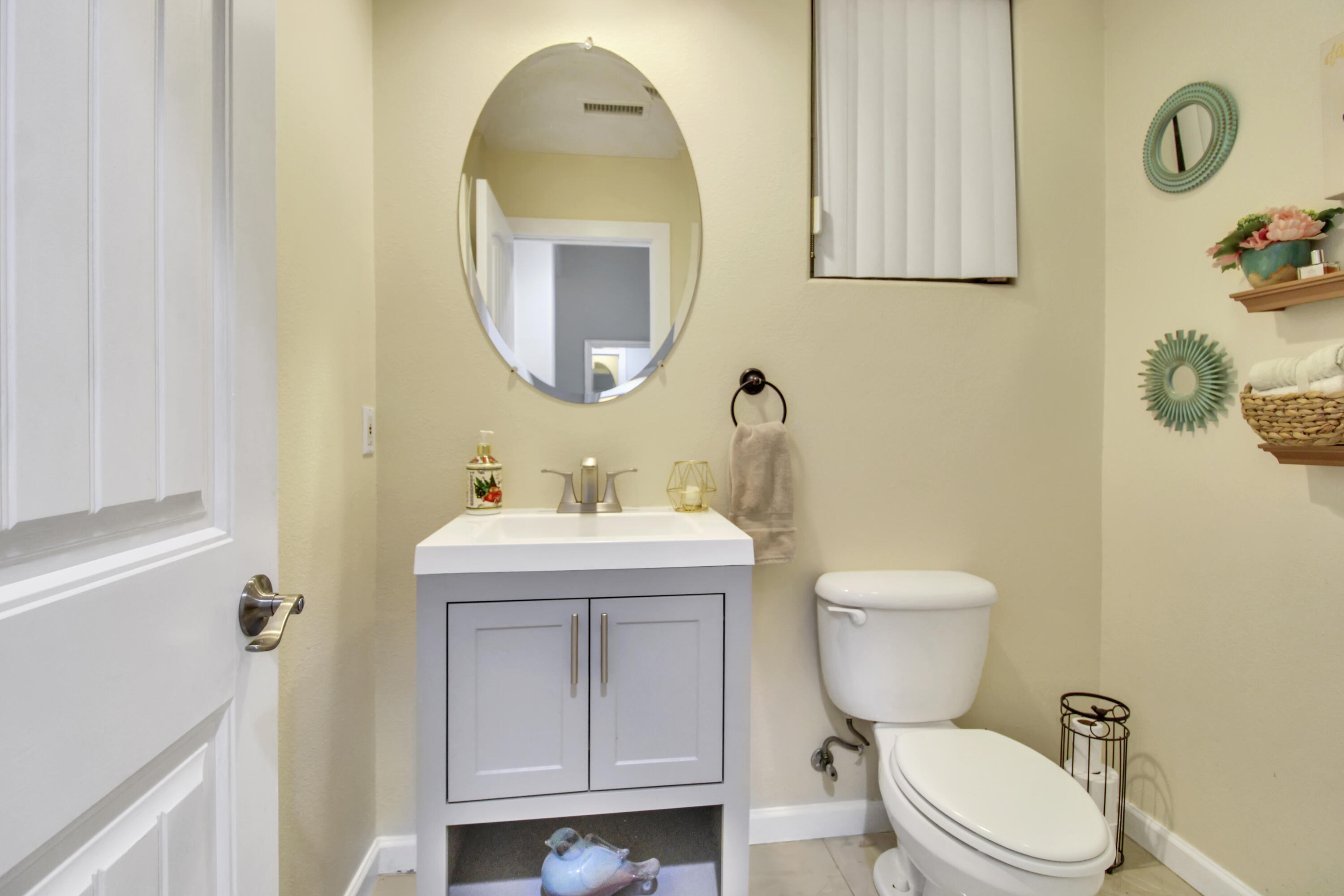 82949 Corte Lucia Indio, CA 92201 - Photo 9 of 36 a bathroom with a toilet sink and mirror