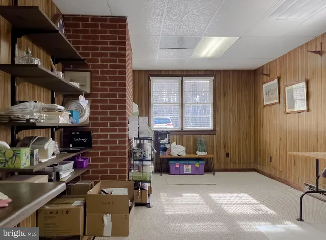 a workspace with furniture and window
