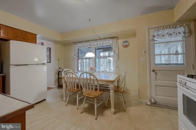 a kitchen with stainless steel appliances granite countertop a sink and a microwave