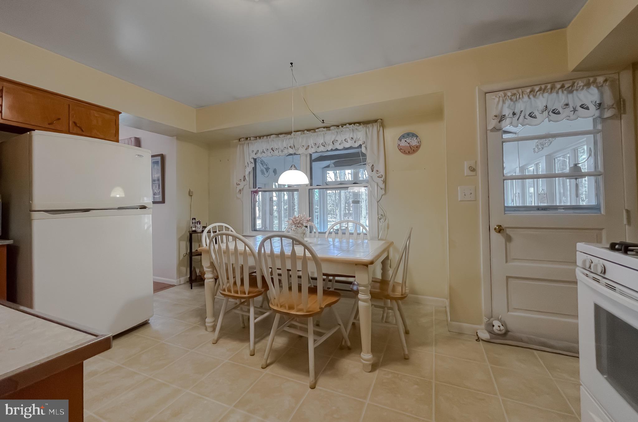 49078 Wynne Road Ridge, MD 20680 - Photo 17 of 57 Bright and inviting kitchen space.