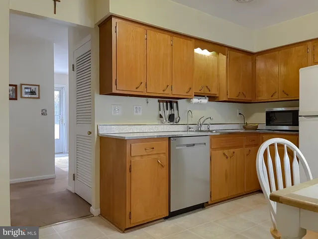 a kitchen with stainless steel appliances granite countertop a stove and a sink