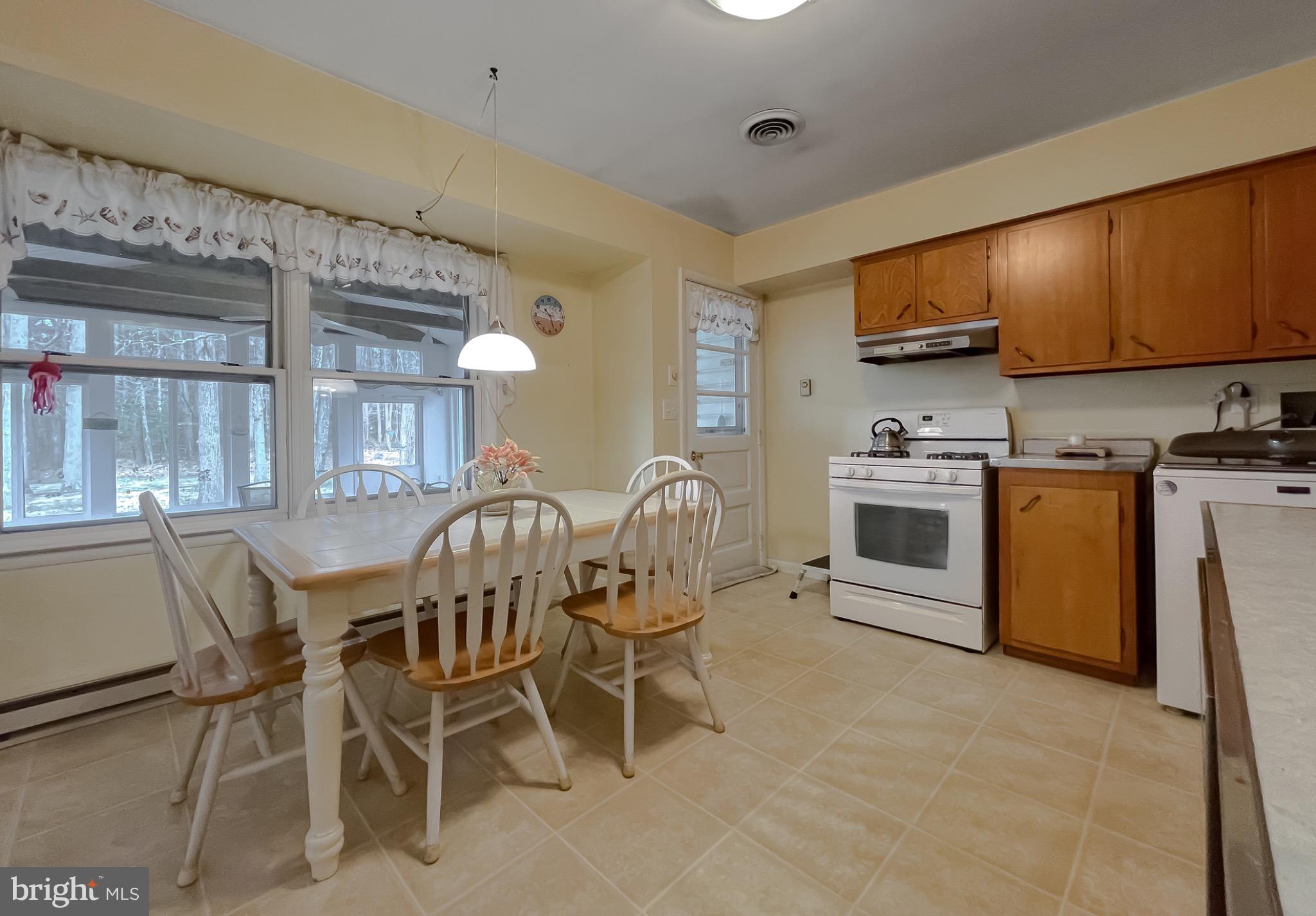 49078 Wynne Road Ridge, MD 20680 - Photo 20 of 57 Bright and inviting kitchen with natural light.