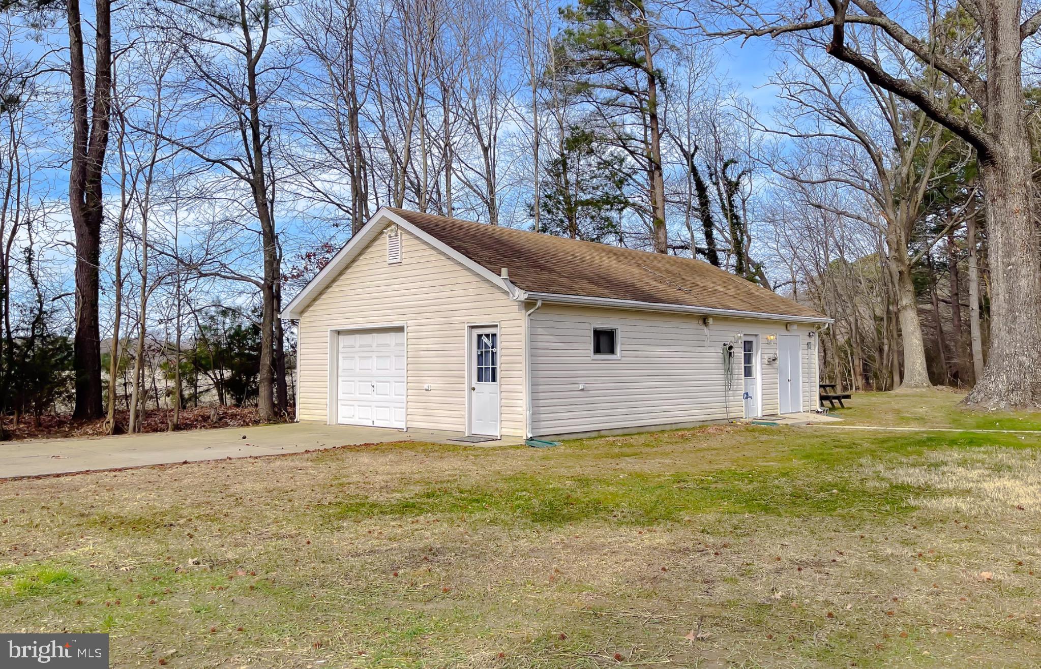 49078 Wynne Road Ridge, MD 20680 - Photo 49 of 57 Oversized garage with workshop.