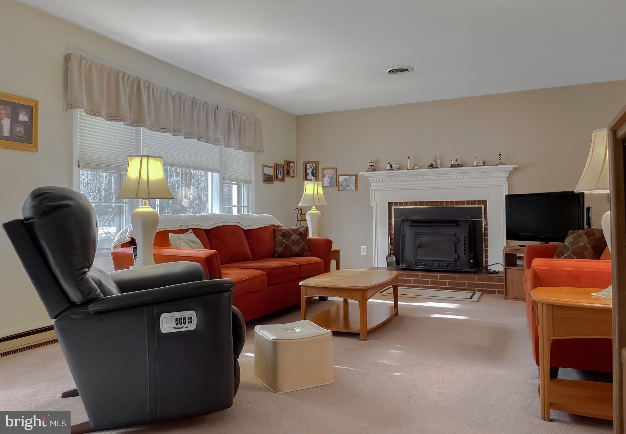 49078 Wynne Road Ridge, MD 20680 - Photo 5 of 57 Living room with warm, inviting tones.