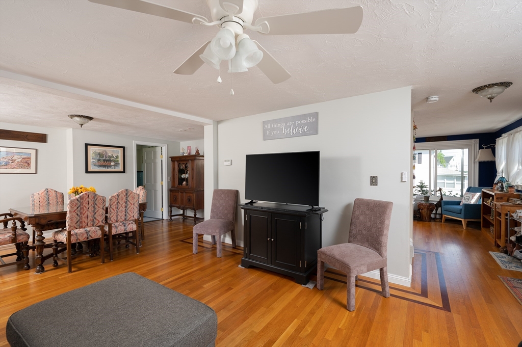 29 Wituwamat Road Weymouth, MA 02191 - Photo 22 of 42 a living room with furniture and a flat screen tv