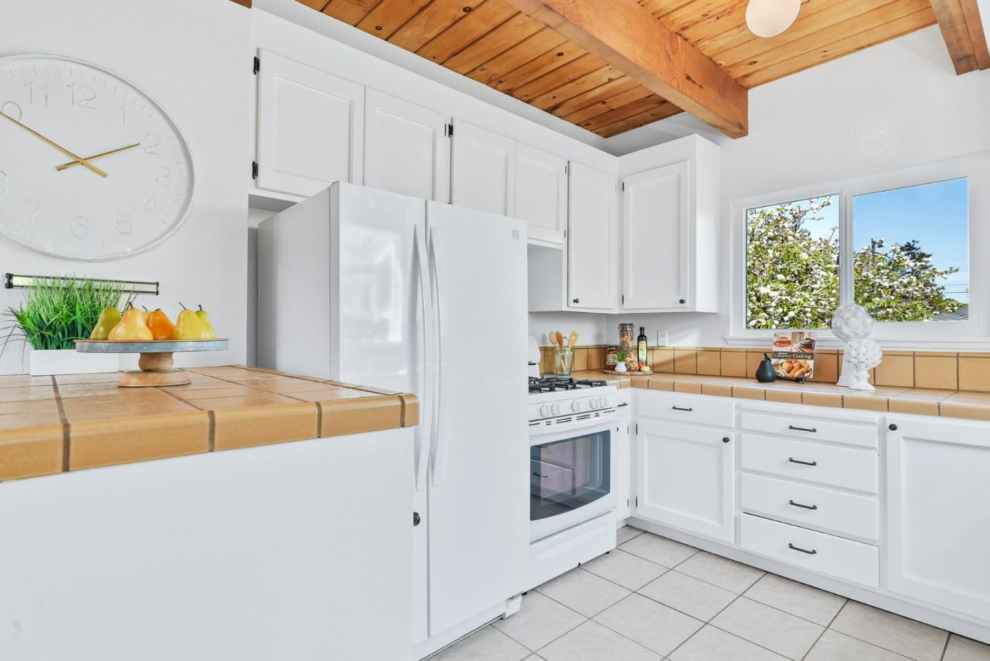 620 Sumner Street Santa Cruz, CA 95062 - Photo 12 of 45 a kitchen with white cabinets and white appliances