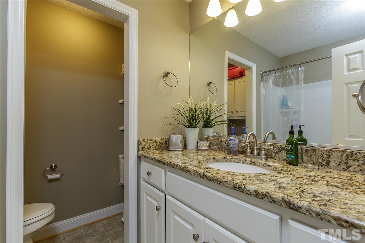 1901 Wellington Road Burlington, NC 27217 - Photo 13 of 24 Master bathroom has been updated with newer vanity and granite countertop. Also has storage inside water closet/room