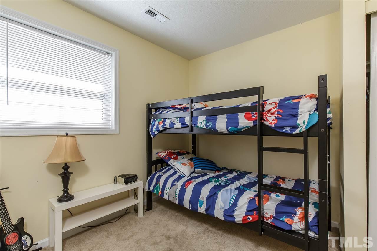 1901 Wellington Road Burlington, NC 27217 - Photo 23 of 24 This room is on the lower level of the split floor plan and is being used as a bedroom. Could be used as a craft room/office as it has 2 closets with access to bathroom